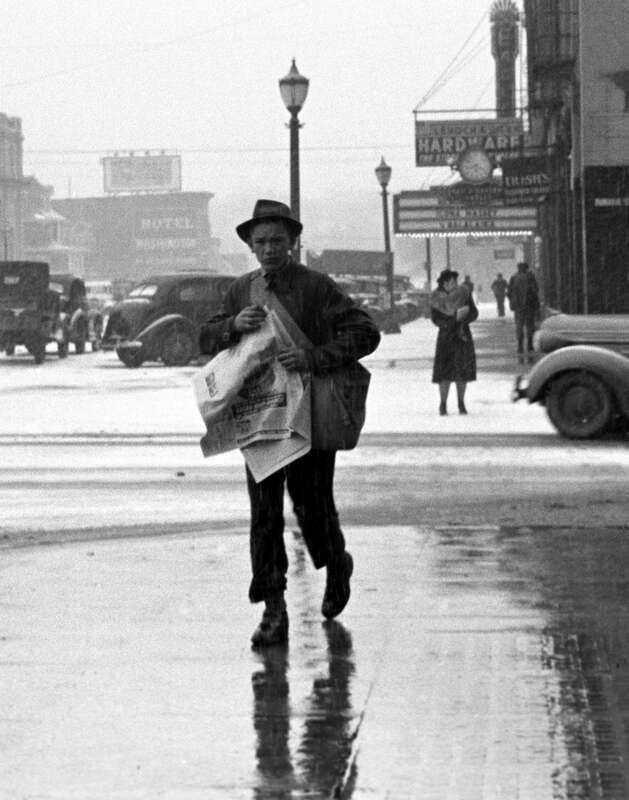 Paperboy, Iowa City, Iowa, 1940, by Arthur Rothstein. This is a cropped image, looking east into the 200 block of Washington Street.  Although cropped from this image, the Jefferson Hotel is just right of the carrier (to his left) at a spot now the