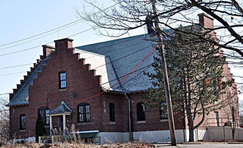 A photograph of the historic City Stable and Garage in Newton, Massachusetts.
