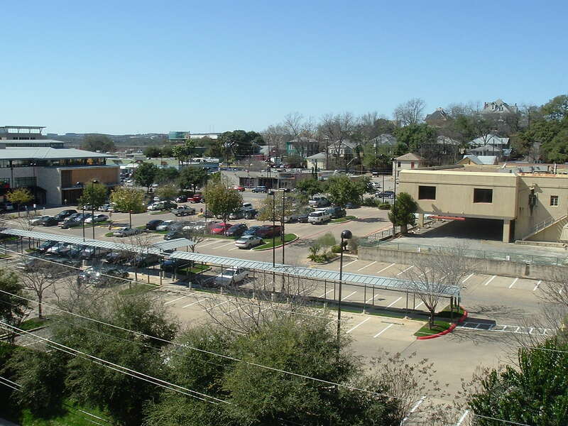 Old Whole Foods store (left) and parking lot. They moved a block south to 6th Street and Lamar in 2005, and it's now the new location for Book People. I love the neighborhood on the hill across Lamar.
Taken from the roof a parking garage on