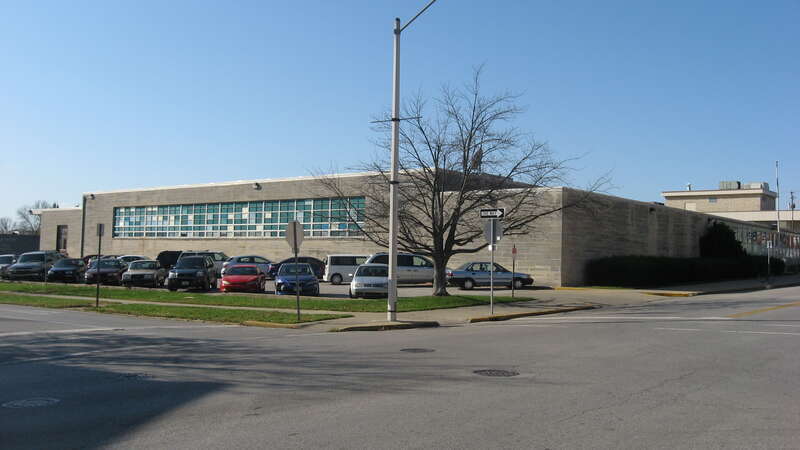 Front and eastern side of the former U.S. Post Office, which occupies the block surrounded by Fourth, Washington, Third, and Lincoln Streets in downtown Bloomington, Indiana, United States.  Built in 1959, the post office closed in 2011 and was