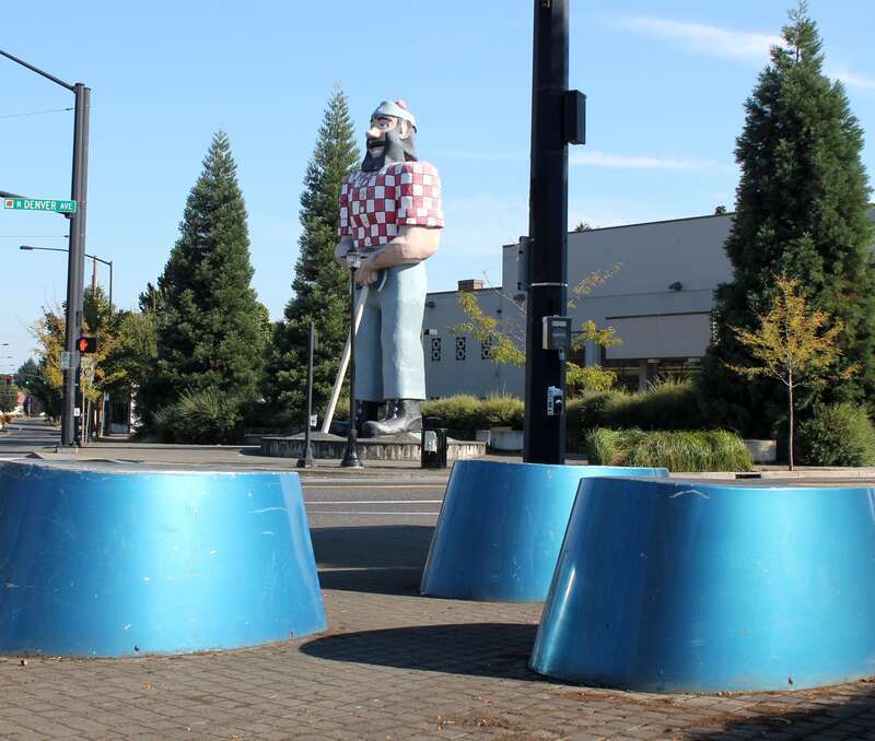 Paul Bunyan Statue Statue of Paul Bunyan in Kenton, a neighborhood in north Portland, Oregon. Symbolic hooves of his blue ox, Babe, in foreground serve as public seating.