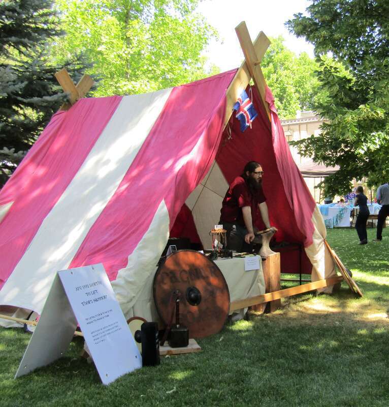 Tent at the Fire &amp;amp; Ice Festival in Spanish Fork, Utah challenging festivalgoers to lift Thor's hammer.
