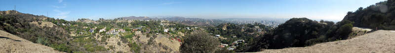 Nine-image 180-degree panoramic looking north-east to south-west from the west trail in Runyon Canyon. The neighborhood for the expensive residences is the Hollywood Hills. The Hollywood Sign, Hollywood and Downtown Los Angeles are visible. See