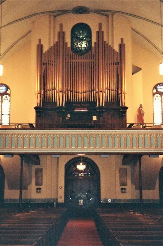 Pipe organ and gallery of St. Mary's Catholic Church in Iowa City, Iowa. This is a scan of a photograph taken in 1992.