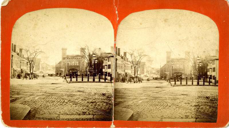 Stereo view looking south at the Eastern Railroad depot from Town House Square, with Washington Street visible.