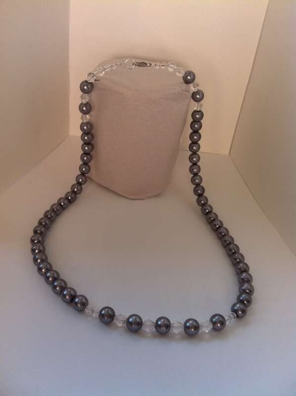 Hand crafted necklace of  Swarovski crystals and faux Tahitian pearls.