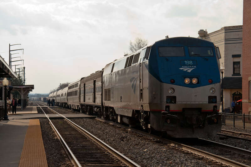 Amtrak 50, the Cardinal has arrived in Manassas, Virginia on a Friday evening to pickup and discharge passengers. Amtrak runs on Norfolk Southern rails through Manassas as does Virginia Railway Express, the local commuter railway.