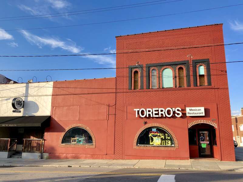 These buildings were damaged when a former Studebaker car dealership built in the early 20th Century on their block exploded in the spring of 2019.  Insurance payouts have yet to be decided, leaving the buildings vacant, businesses closed, and in a