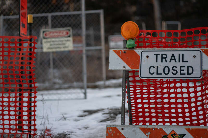 A trail closed sign on a trail in Minneapolis where the Southwest LRT is being built.