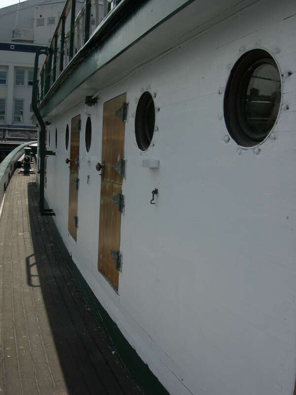 Starboard walkway of the tugboat Arthur Foss, built 1889, one of the historic fleet of Northwest Seaport, South Lake Union Park, Seattle, Washington, USA. The tug is a Seattle city landmark and is listed on the National Register of Historic Places,