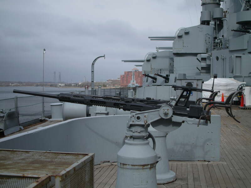 These are the 20mm Oerlikons that are dotted throughout the ship. 20mm is nearly 1&quot; diameter.