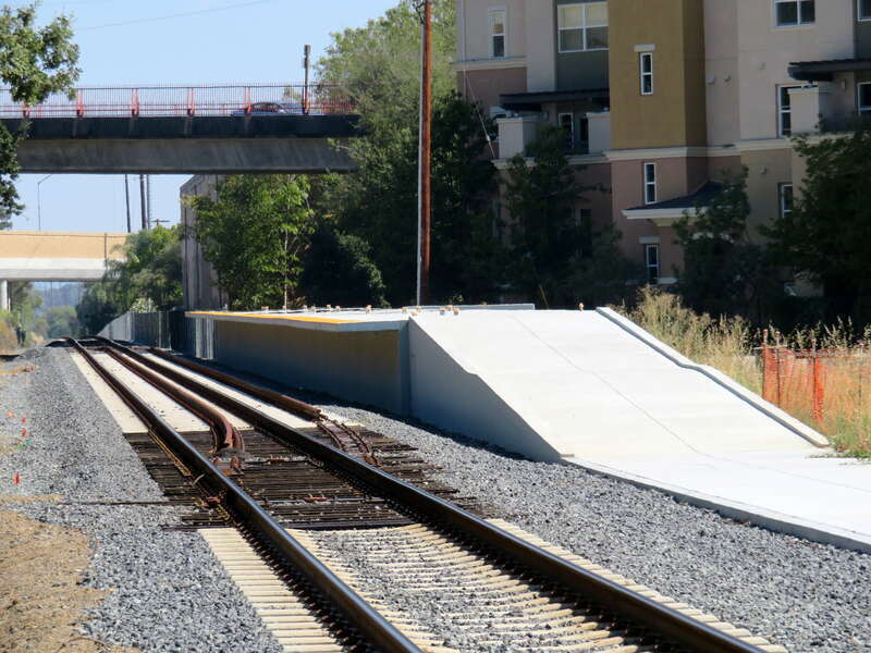 The unfinished platform and gauntlet track at Novato Downtown station in August 2018