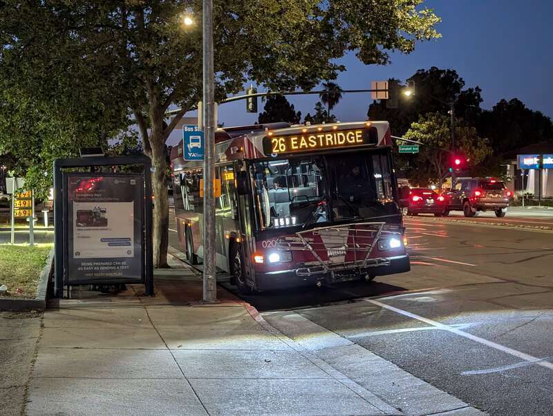 SCVTA bus number 0209, a Gillig Low Floor HEV, serving route 26 eastbound at Campbell Ave and Bascom Ave in Campbell, California at nighttime. The destination sign on the front reads &quot;26 EASTRIDGE&quot;.