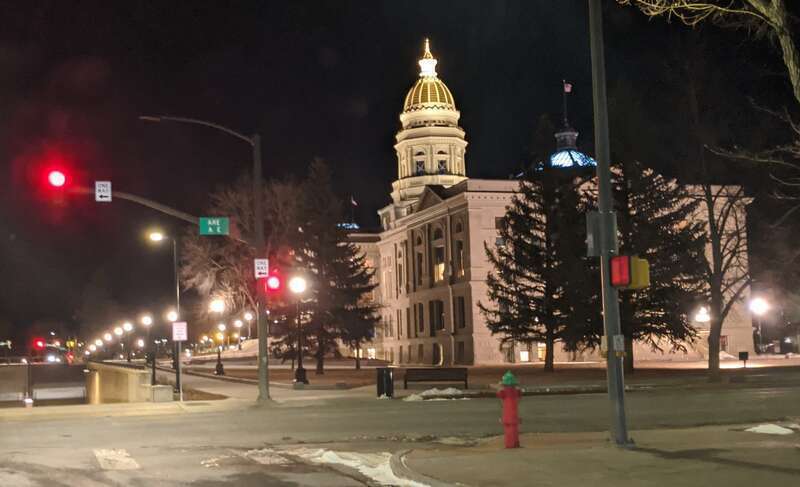 Side of Wyoming State Capitol at night