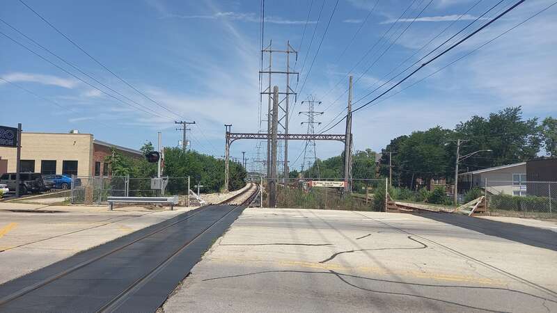 One of several grade crossings on the Yellow Line (CTA), looking north from Main Street in Skokie. This is the site of the now-demolished Main station on the Skokie branch.