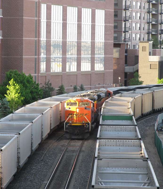 BNSF heavy haul coal train rumbles West through Downtown Denver, CO.