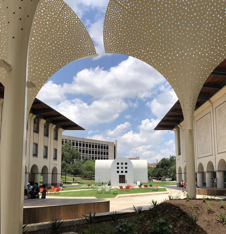 Exterior grounds and plaza designed by Snøhetta at the Blanton Museum of Art in Austin, Texas. Features include twelve towering, three-stories-tall &quot;petals&quot; which provide perforated shade. In the center of the photo is Ellsworth Kelly's Austin