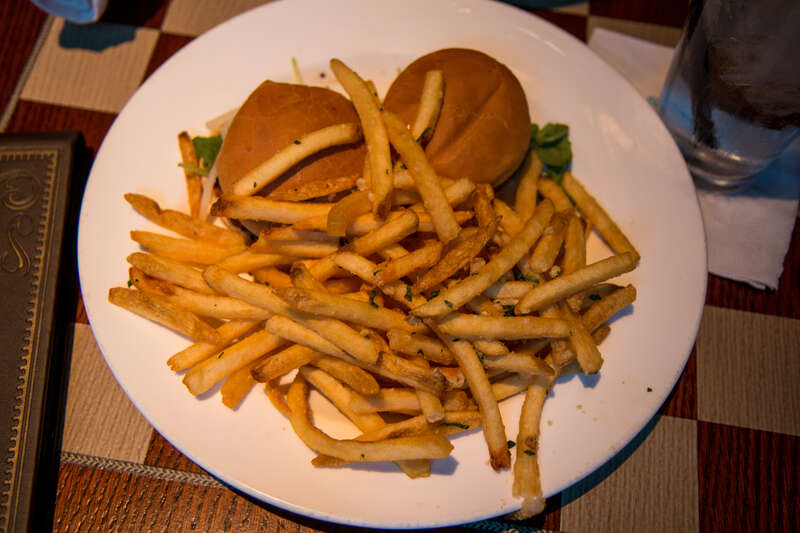 At the Hearthstone Lounge: Two Mini Wagyu Sliders topped with Cabrales Blue, Bing Cherry-Cabernet Spread, Arugula, Pears, and a side of Garlic-Herb Skinny Fries.
