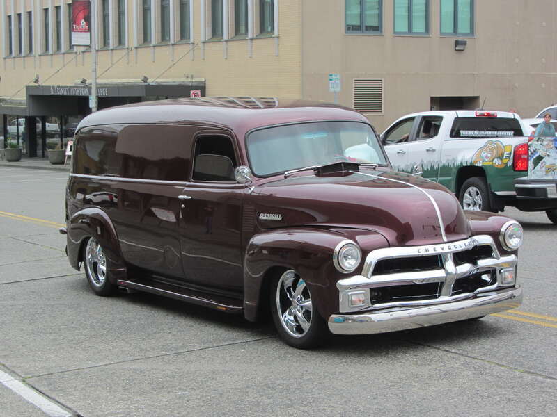 This Chevy owner added an extra door on the streets side, rather than the usual curb side.  They did build some of these long version vans, but first one I've seen as a street machine