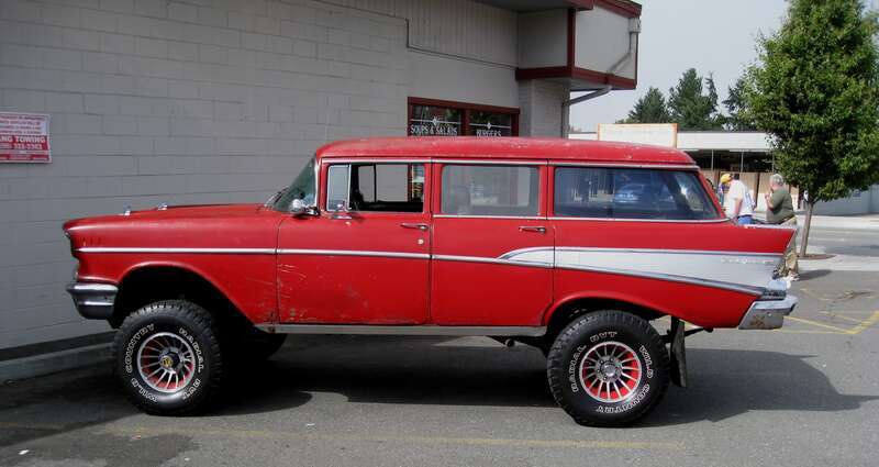 This is quite a modified 1957 Chevy wagon that I saw at Leenas - my favorite local North City diner. I thought is was quite interesting, I had to run back and get my camera - for some reason, my wife was more interested in getting brekky.

s100724