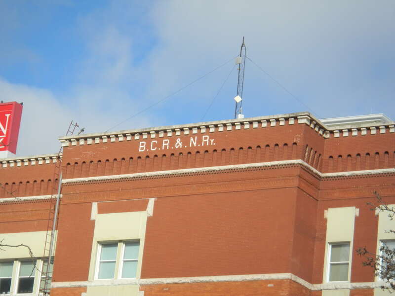 Initials on the side of the former corporate headquarters of the Burlington, Cedar Rapids and Northern Railway, currently a Skogman Realty office in Cedar Rapids, Iowa