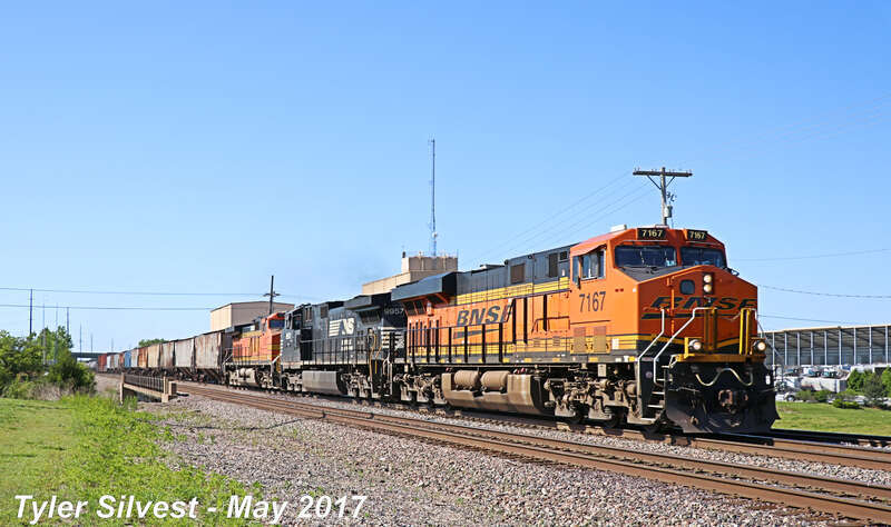 Burlington Northern Santa Fe 7167(ES44C4), Norfolk Southern 9957(C40-9W) and 5101(C44-9W) Leads a Manifest Northbound on the BNSF Fort Scott Sub just before the CP 215 Signals near Dennis Avenue Crossing East of Keeler Street in Olathe, Kansas.
Video