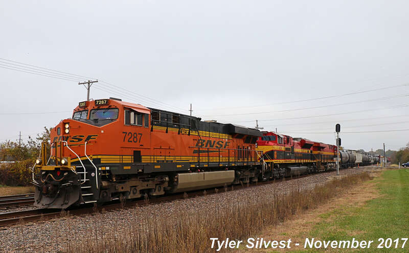 Burlington Northern Santa Fe 7287(ES44DC), Kansas City Southern 4176(SD70ACe) and 4816(ES44AC) Leads a Manifest Southbound on the BNSF Fort Scott Sub at the CP 215 Signals near Dennis Avenue Crossing East of Keeler Street in Olathe, Kansas.
Train: H