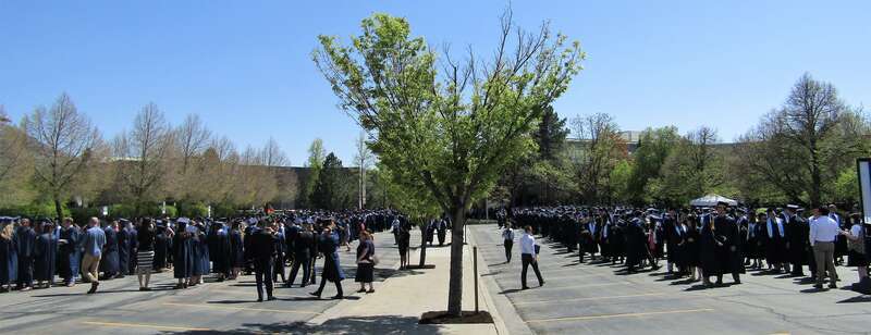 BYU graduates waiting to march to the Marriott Center for Commencement.