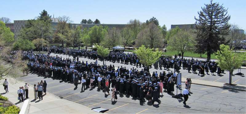 BYU graduates waiting to march to the Marriott Center for Commencement.
