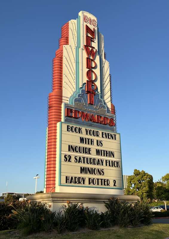 The colorful neon sign marquee outside of the Regal Edwards Big Newport theater in Newport Beach, California. This movie theater complex was the flagship location of the former  chain from 1969 until the company's bankruptcy in 2000.