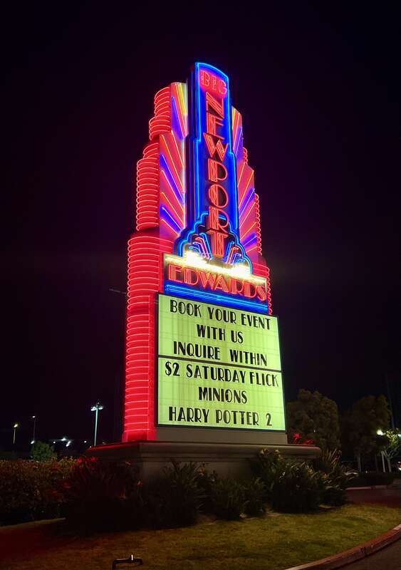The colorful neon sign marquee outside of the Regal Edwards Big Newport theater in Newport Beach, California. This movie theater complex was the flagship location of the former  chain from 1969 until the company's bankruptcy in 2000.