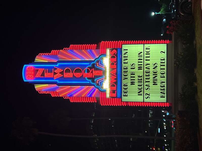 The colorful neon sign marquee outside of the Regal Edwards Big Newport theater in Newport Beach, California. This movie theater complex was the flagship location of the former  chain from 1969 until the company's bankruptcy in 2000.