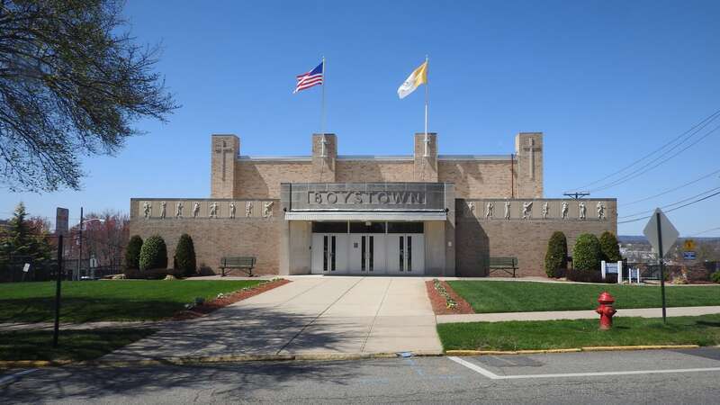 Looking west at Boys Town building on a sunny midday
