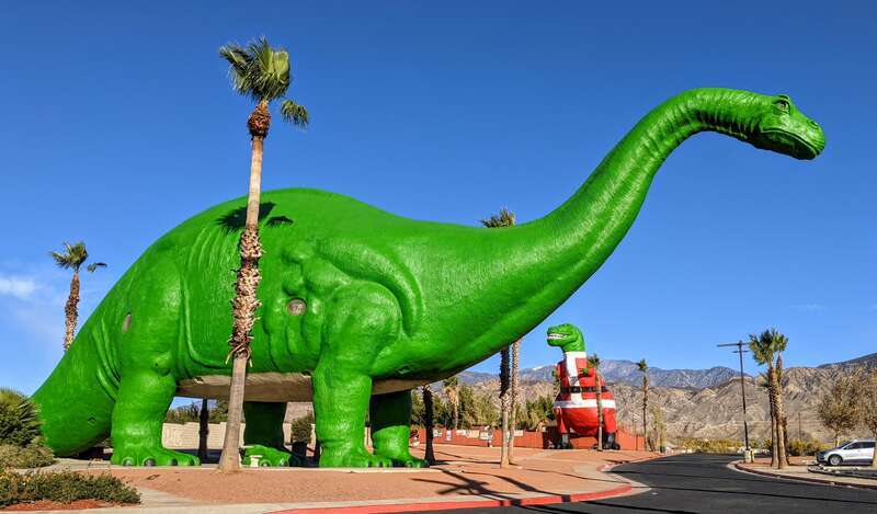 Cabazon Dinosaurs, fall 2020, in Christmas-themed paint. Cabazon, California.