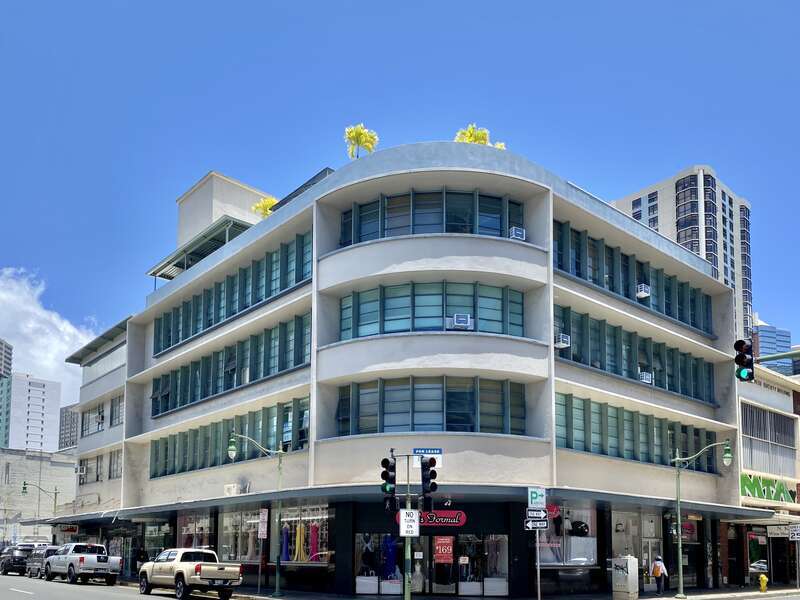 Built in 1955, this modernist building was designed by Ernie Hara for the Central Pacific Bank.  The concrete building features concrete canopies on each floor, ribbon windows on the second, third, and fourth floors, a rounded corner, a first floor