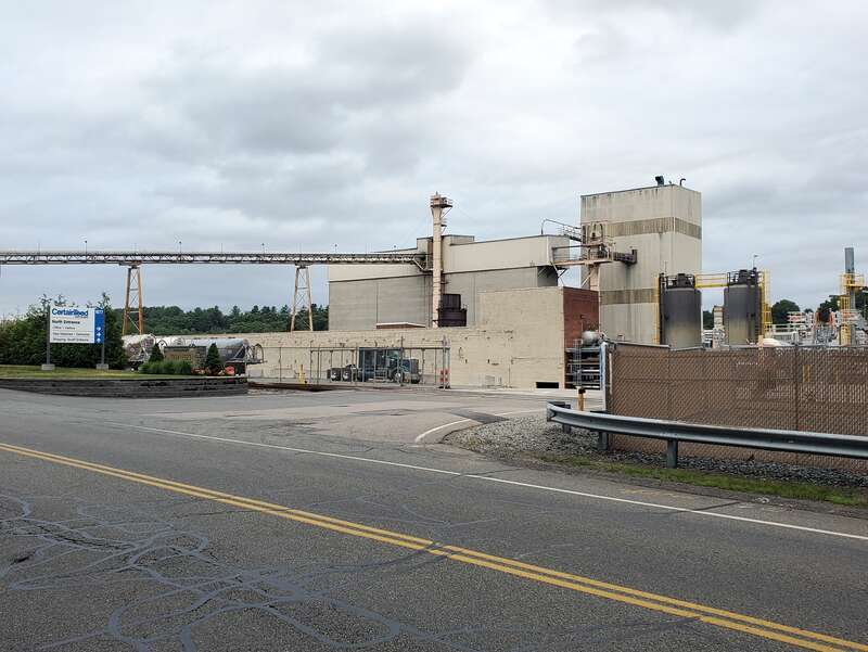 CertainTeed plant in Norwood, Massachusetts in July 2021. A grade crossing of the Wrentham Branch stub - which now only serves the plant - is visible.