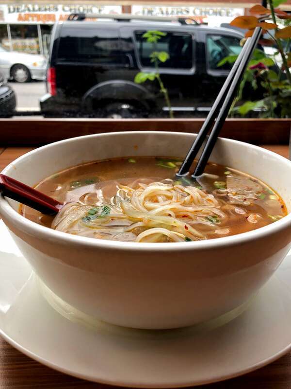 Pho served with meatballs in chicken broth with added seasoning. Nashville restaurant Love, Peace, &amp;amp; Pho.