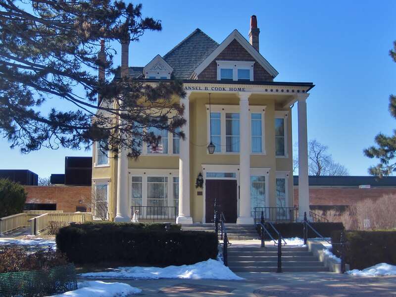 Cook Memorial Library in Libertyville (1878). The George Vardin family built a log cabin on this site in 1834. In 1837, the cabin became the town's first post office. It was at this time that they name Libertyville became associated with the town;