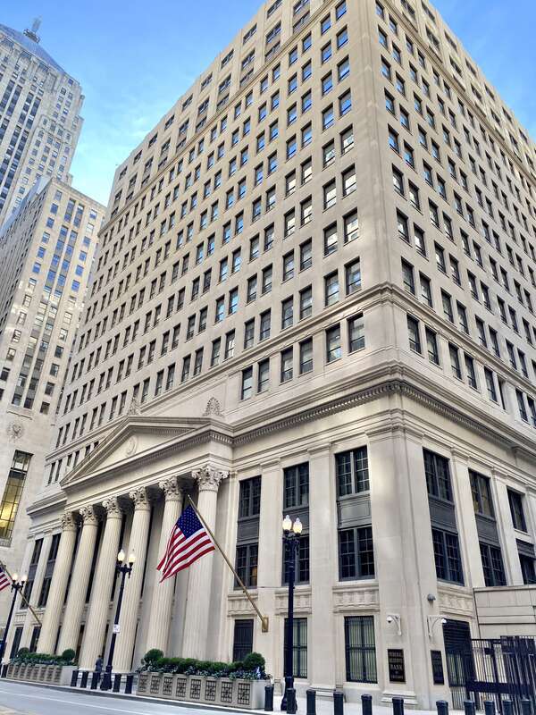Federal Reserve Bank of Chicago as seen from LaSalle Street. The Chicago Board of Trade is partly visible in the background.
