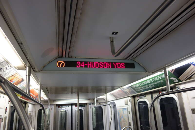 The interior of an R188 train in 7 service, taken on the IRT Flushing / 42nd Street line between Times Square and 34th Street – Hudson Yards in Midtown Manhattan.