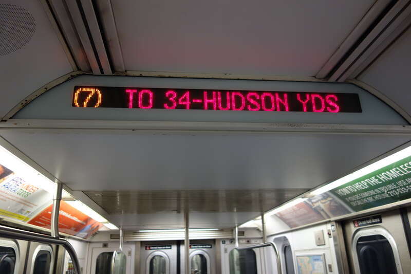 The interior of an R188 train in 7 service, taken on the IRT Flushing / 42nd Street line between Times Square and 34th Street – Hudson Yards in Midtown Manhattan.