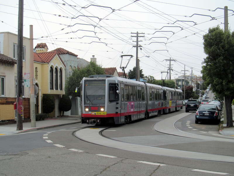 Inbound L Taraval train on 15th Avenue turning onto Ulloa Street in June 2017. A stop at that location was closed on February 25, 2017.