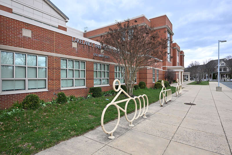 The bike racks in front of Lakelands Park Middle School are shaped like bicycles. Lakelands Park is part of the Montgomery County Public Schools system. 1200 Main Street, Gaithersburg, Maryland 20878.