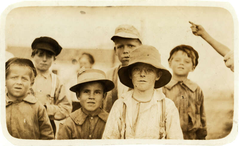 Howard Simmons and Joe Elvis, two of the smallest here, both shuck oysters in Barataria Canning Co. Location: Biloxi, Mississippi. Photograph by Lewis Wickes Hine, February 1911.

From the National Child Labor Committee Collection at the Library of