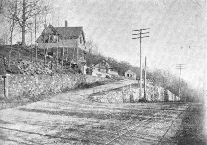 Main Street at Locust Street in Cherry Valley, Massachusetts, around 1895. At right is the single track of the Worcester, Leicester and Spencer Street Railway.