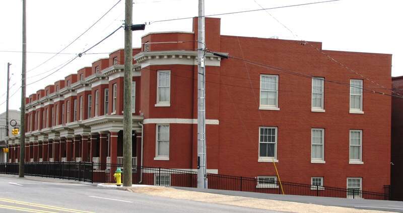 Minvilla Manor at the corner Broaday and Fifth Avenue in Knoxville, Tennessee, USA.  This building was initially constructed as rowhouses in 1913 by real estate developer H. Clay Bondurant (1846–1918) and designed by the prominent local architectural