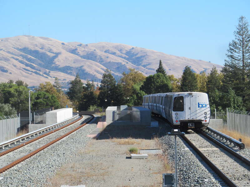 A southbound train leaves Fremont station in October 2017 with Mission Peak in the background