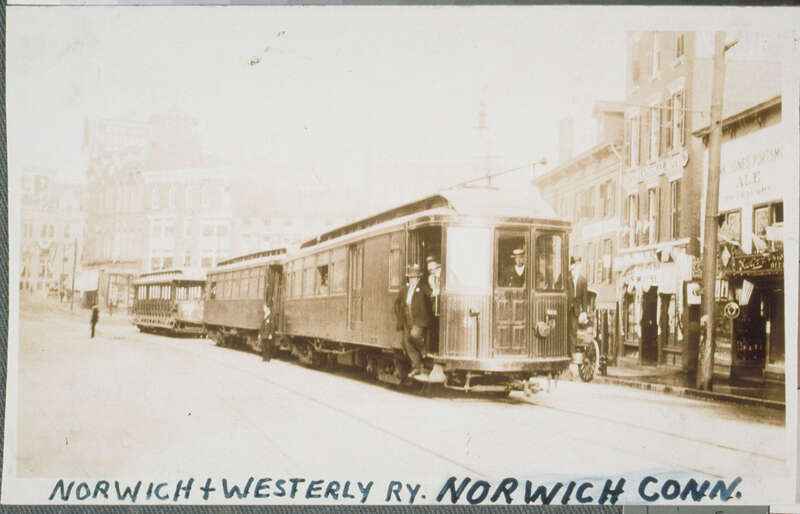 A two-car Norwich and Westerly Railway train at Franklin Square in downtown Norwich. At right is the International Hotel at 248 Main Street.