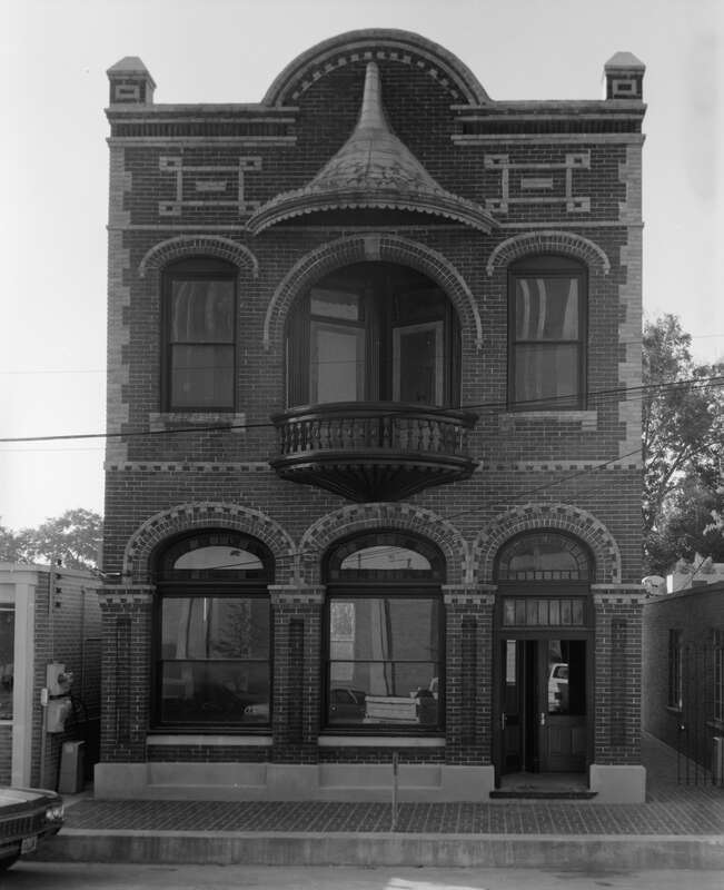 Front of the Old Lafayette City Hall, located at 217 W. Main Street in Lafayette, Louisiana, United States.  A bank at the time this photograph was taken, it was built in 1898, and it is listed on the National Register of Historic Places.