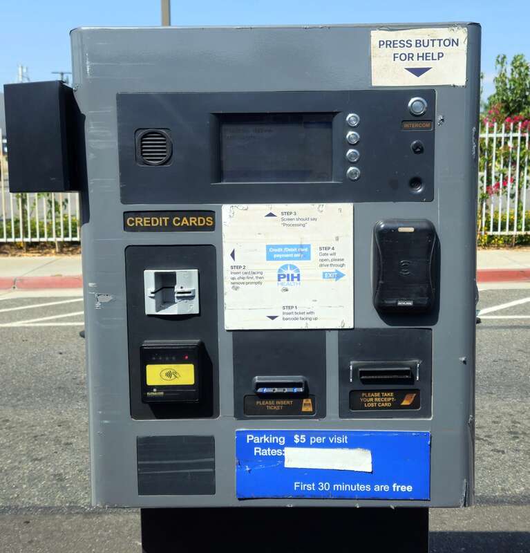 Pat machine at the exit to a parking lot.